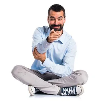 Handsome man pointing to the front Stock Photos