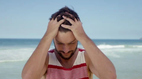 Handsome man posing on beach 库存影片 49613817