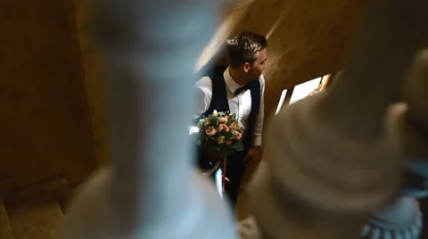 Handsome man posing indoor on the starway Stock Footage 68402637