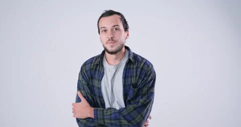 Handsome Man posing over white background in slow motion Stock Footage 143943388