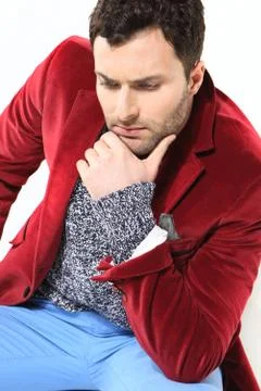 Handsome man posing in a red jacket Foto stock