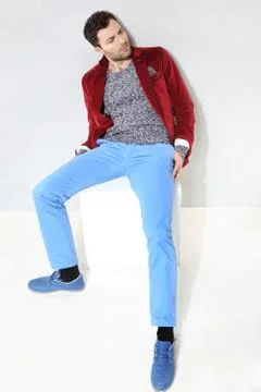 Handsome man posing in a red jacket Stock Photos