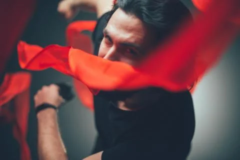 Handsome man posing in studio in backlight. Stock Photos