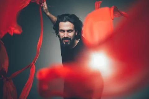 Handsome man posing in studio in backlight. Foto stock
