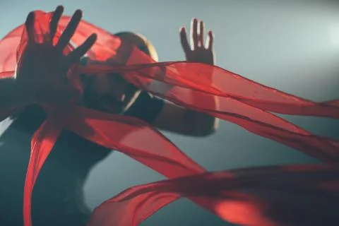 Handsome man posing in studio in backlight. 写真素材