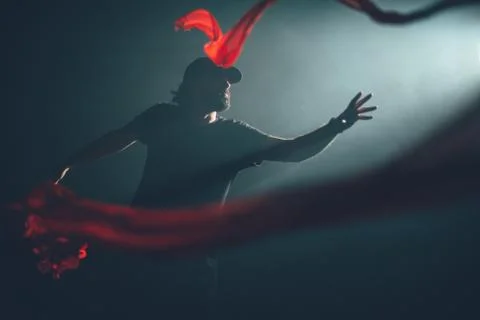 Handsome man posing in studio in backlight. Stock Photos