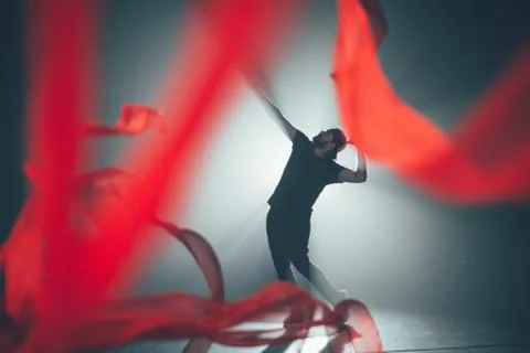 Handsome man posing in studio in backlight. Stock Photos