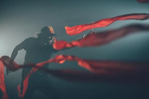 Handsome man posing in studio in backlight. Stock Photos