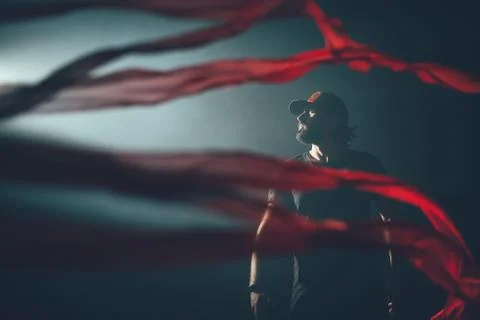 Handsome man posing in studio in backlight. 写真素材