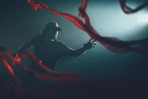 Handsome man posing in studio in backlight. Stockfoto's