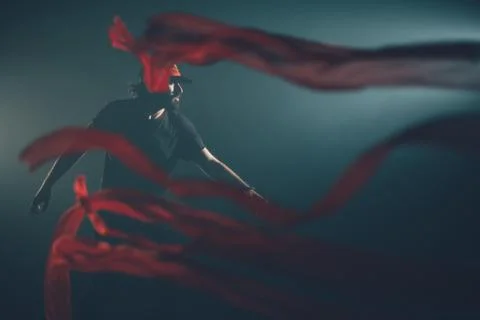 Handsome man posing in studio in backlight. Stock Photos