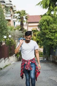 Handsome man posing in an urban context Stock Photos