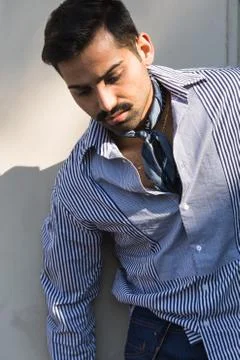 Handsome man posing in an urban context Stock Photos