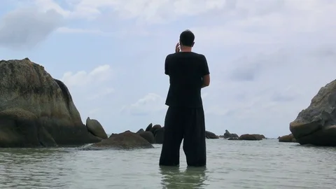 Handsome Man Practicing Tai Chi at the Sea Stock Footage 85425545