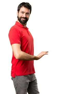 Handsome man presenting something Stock Photos