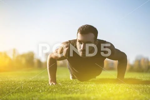 The handsome man pushing up on the grass Stock Photos