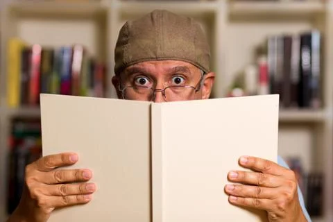 Handsome man reading Stock Photos