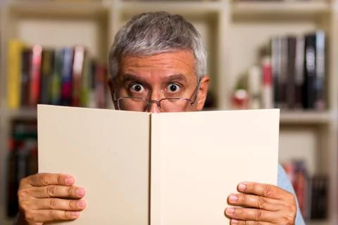 Handsome man reading Stock Photos
