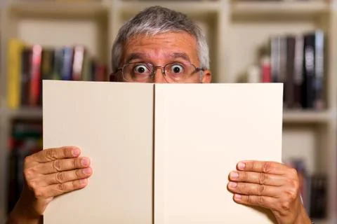Handsome man reading Stock Photos