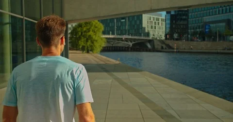 Handsome man on roller skates doing beautiful tricks and spins in city location  Stock Footage 117469632