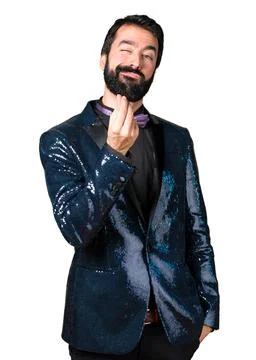 Handsome man with sequin jacket making money gesture Stock Photos