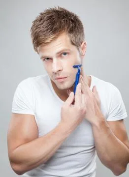Handsome man shaving Stock Photos
