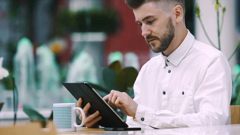 Handsome man in shirt working in cafe Stock Footage 97089986