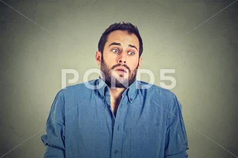 Handsome man shrugging shoulders showing ignorance Stock Photos