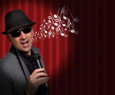 Handsome man singing with musical notes coming out of his mouth Stock Photos