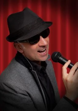 Handsome man singing Stock Photos