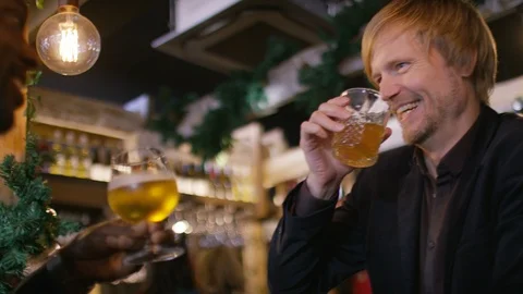 Handsome man sits down and drinks with his friend Video stock 102241077