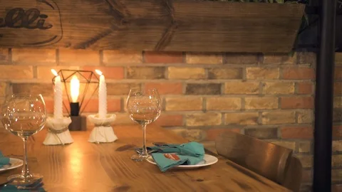 Handsome man sitting on table with burning candles for romantic dinner. Young Stock Footage 103210096