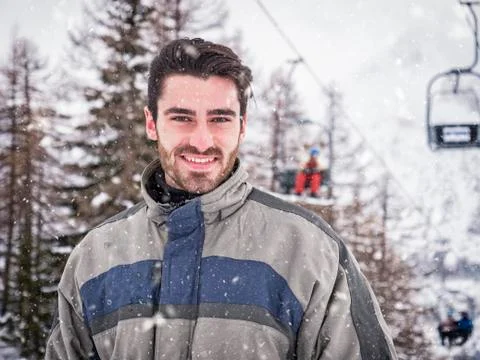 Handsome man with ski smiling to camera Stock Photos