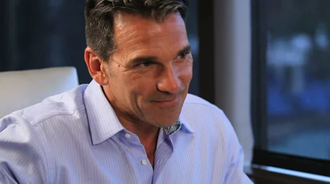Handsome man smiles off screen Stock Footage 36764738