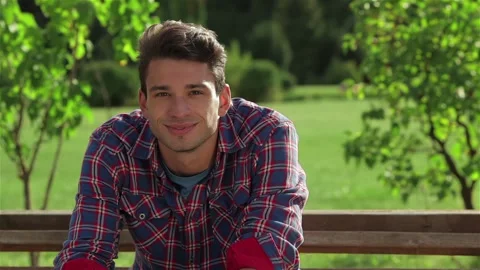 Handsome man is smiling at the camera Stock Footage 252679628