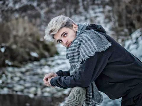 Handsome man in snow posing for camera Stock-Fotos
