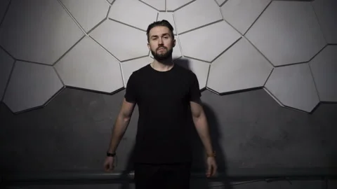 Handsome man is standing at the wall Video stock 86255712