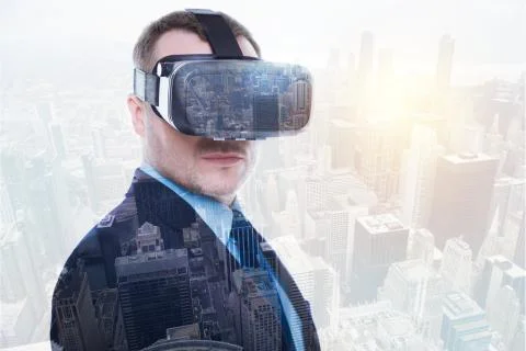 Handsome man in suit posing while wearing VR headset 库存照片
