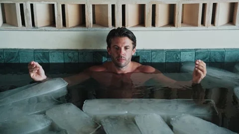 Handsome Man in Swimming Pool or Healthy Bath with Ice Cubes and Cold Water Stock Footage 285104237