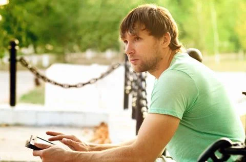 Handsome man with tablet pc in the park outdoor young businessman technology  Stock Photos