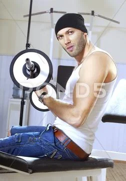 Handsome man takes exercises Stock Photos