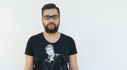 Handsome Man Taking Off Glasses with Right Hand and Laughing Stock Footage 66419391