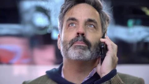 Handsome man talking on mobile cell phone in City Stock Photos