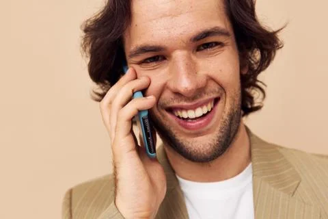 Handsome man talking on the phone technologies Lifestyle unaltered Stock Photos