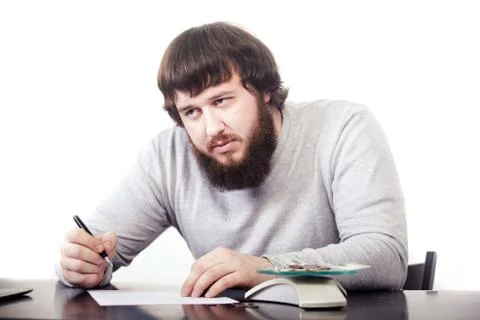 Handsome man is thinking about his future. Stylish hair and beard. looking on Stock Photos