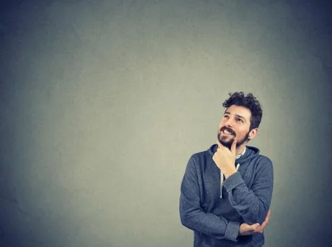 Handsome man thinking looking up Stock Photos
