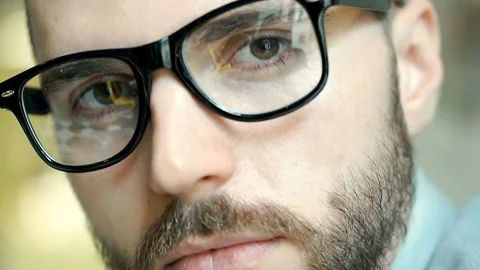 Handsome man touching his beard and looking to the camera, close up, steadycam s Stock Footage 73186695