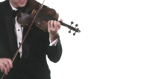 Handsome man in tuxedo performs fast composition on a classical violin. Isolated Stock Footage 134495403