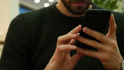 Handsome man typing on smartphone sms 库存影片 140743426