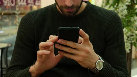 Handsome man typing on smartphone sms Video stock 140743461